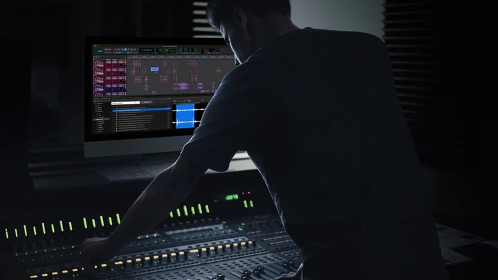 Soundly and a DAW open side by side at a studio mixing console.