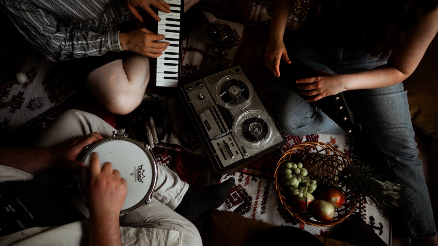 Melkutus Party gathered around acoustic and electronic instruments.